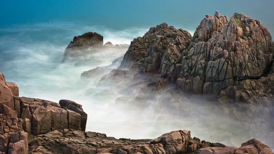 Surf breaking on a rocky coast